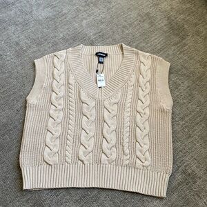 Express sweater vest. Size medium. New with tags.